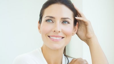 Close up of a middle-aged woman's firm face smiling