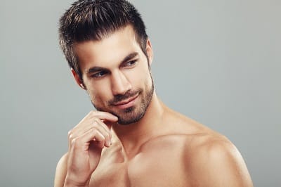 Man holding his hand to his chin