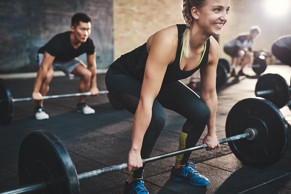 Woman working out at the gym more comfortably after breast reduction