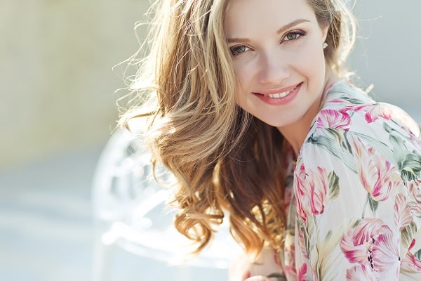 Woman outdoors with great skin after IPL treatment and hair stlyed