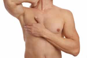Muscular male torso, chest and armpit hair removal