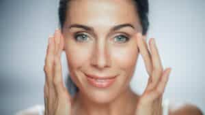 Woman with refreshed eyes and smooth under-eye area after eyelid rejuvenation treatment
