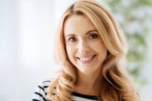Woman with smooth, youthful facial contours and a refreshed appearance after a natural-looking facelift.